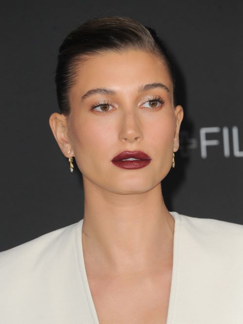 Hailey Bieber with rounder low-arched eyebrows