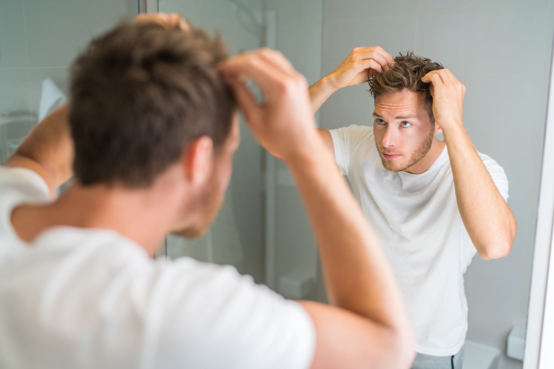 Man taking care of his hair