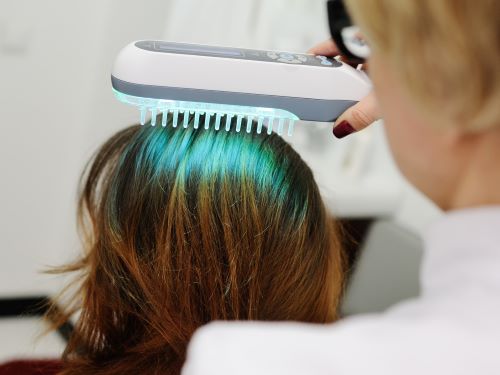 woman undergoing UV phototherapy to treat scalp psoriasis