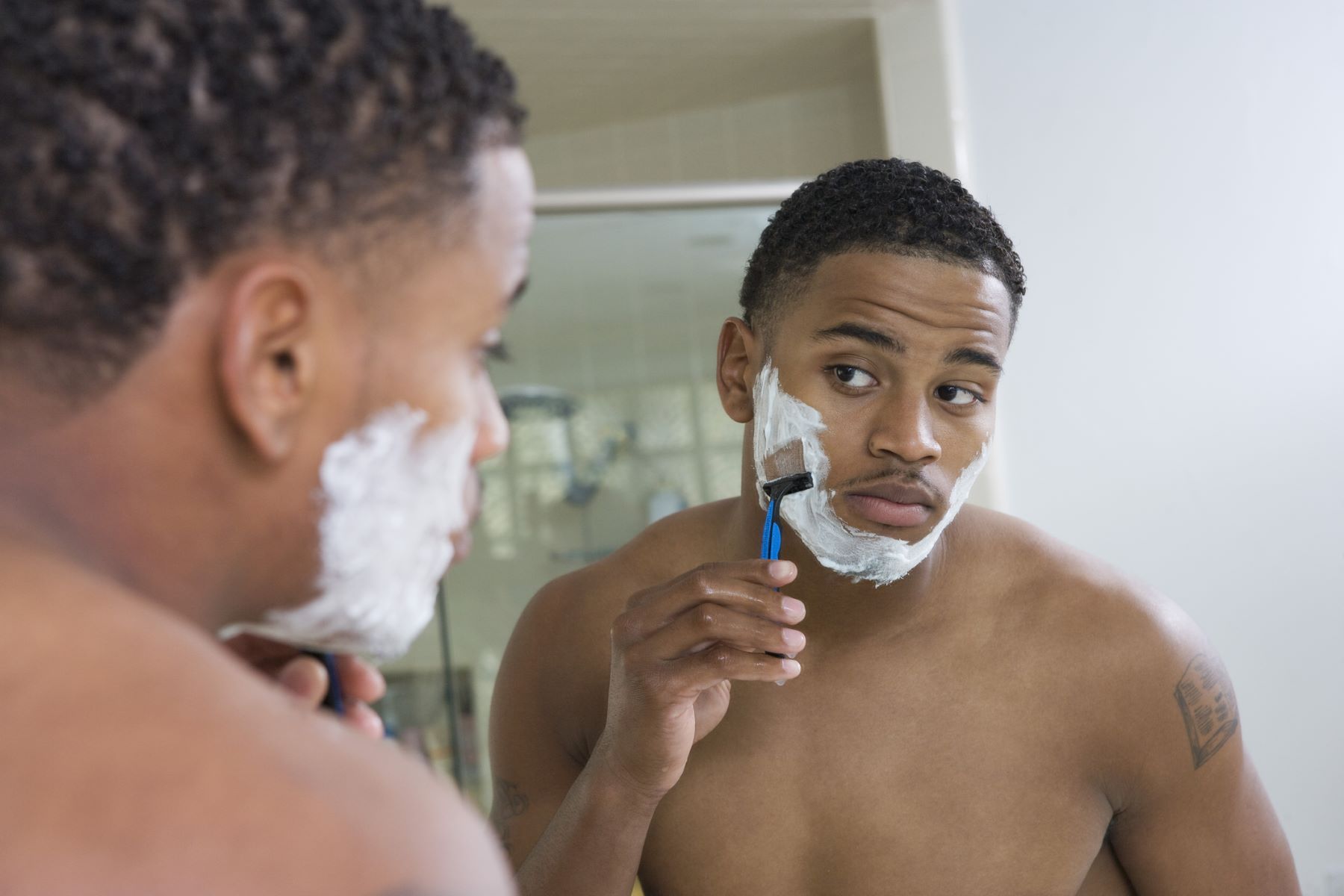 Man shaving his beard