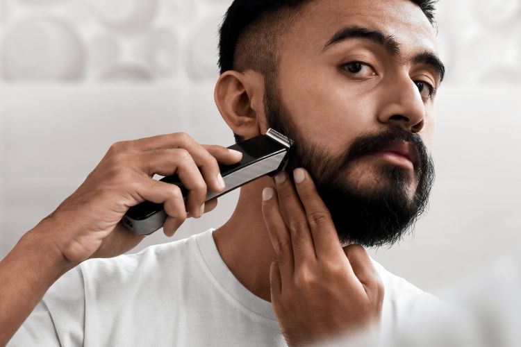 Man trimming and styling his beard