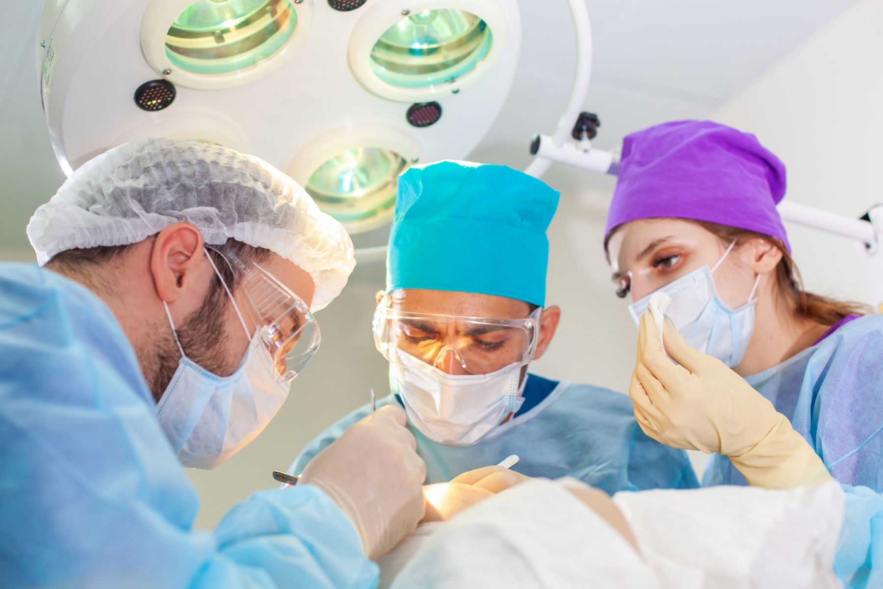 Hair transplant surgeons in operating room