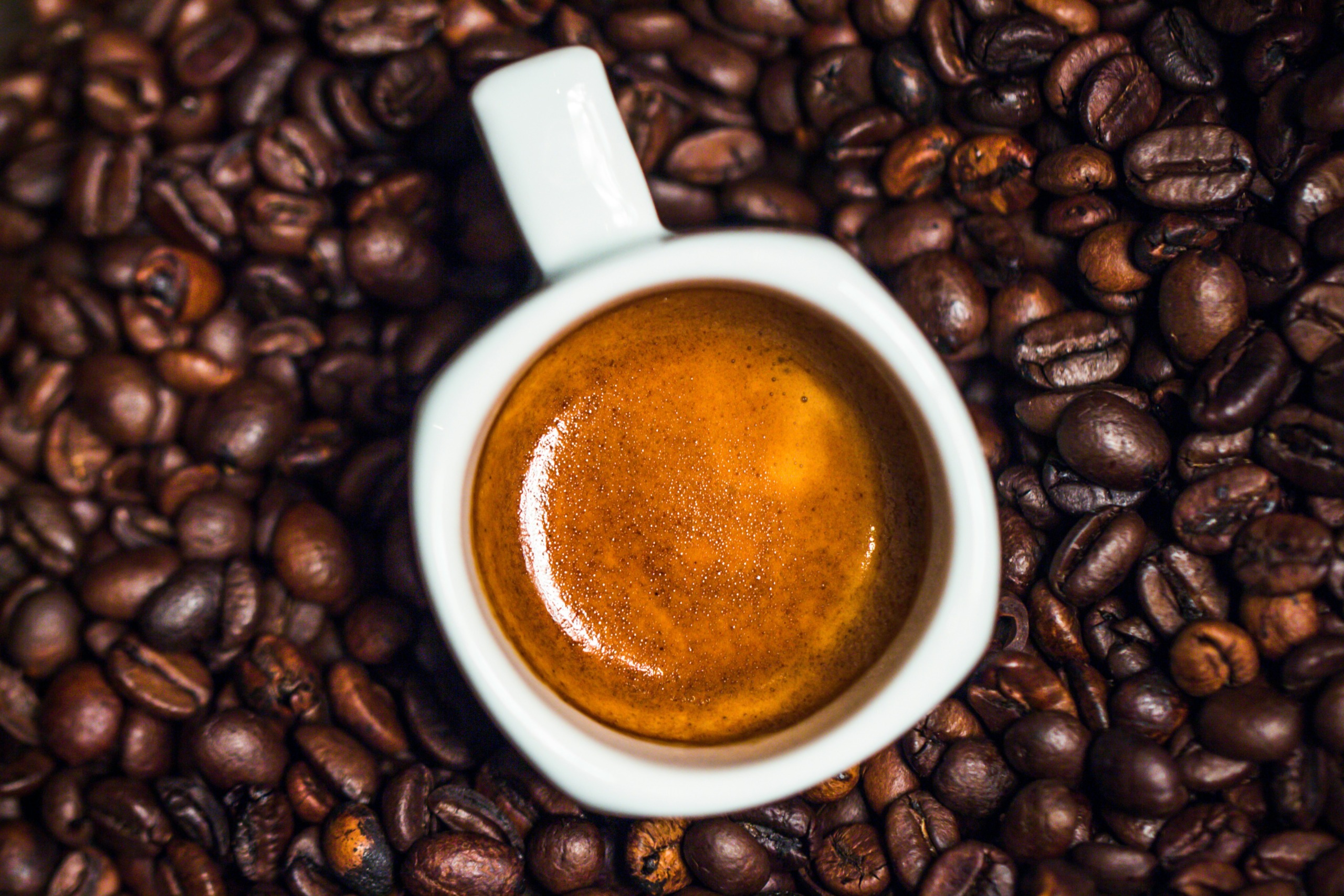 espresso on coffee beans