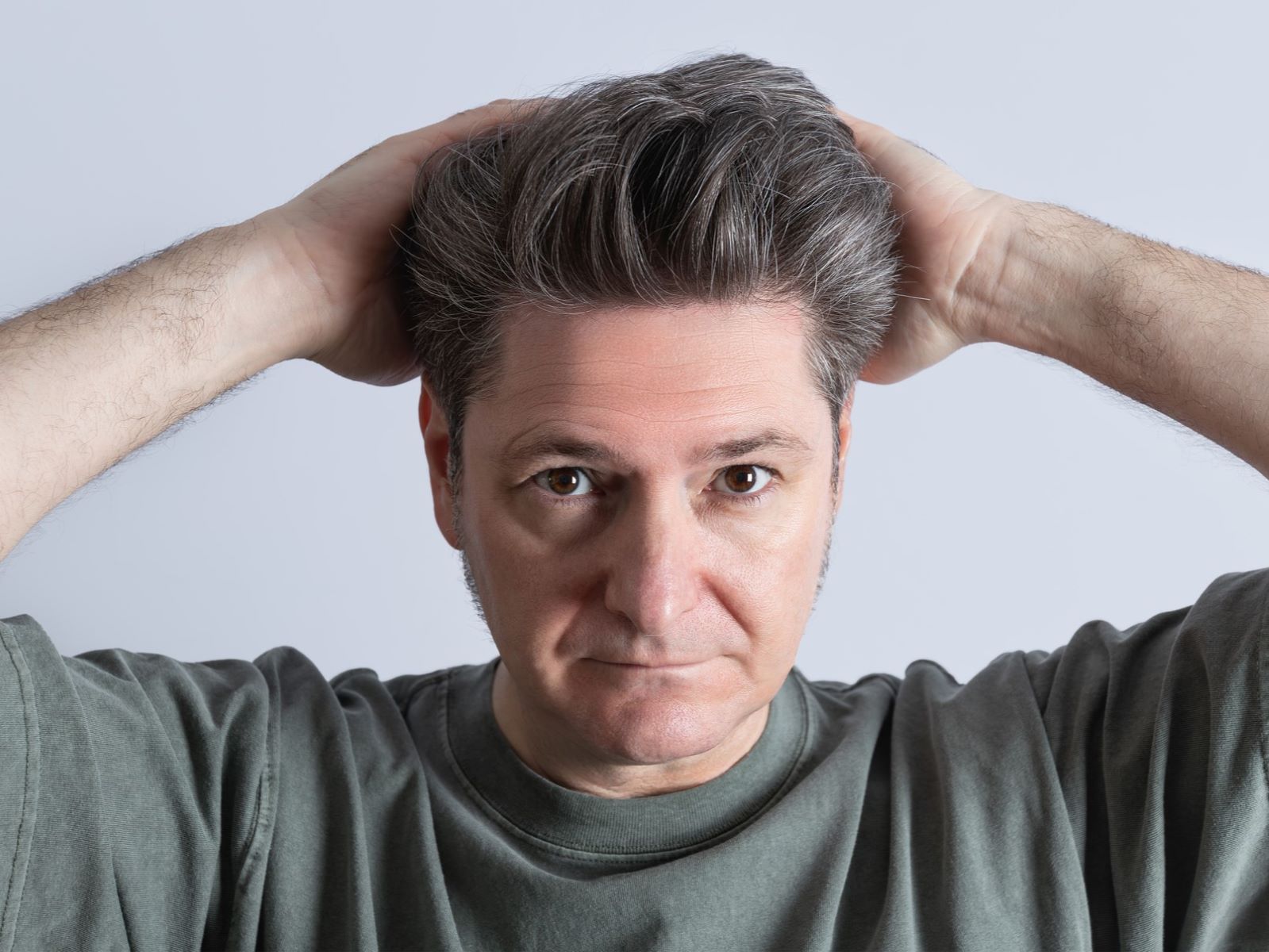 Middle-aged man with bouffant toupée