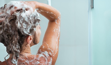 Woman Using Minoxidil Shampoo