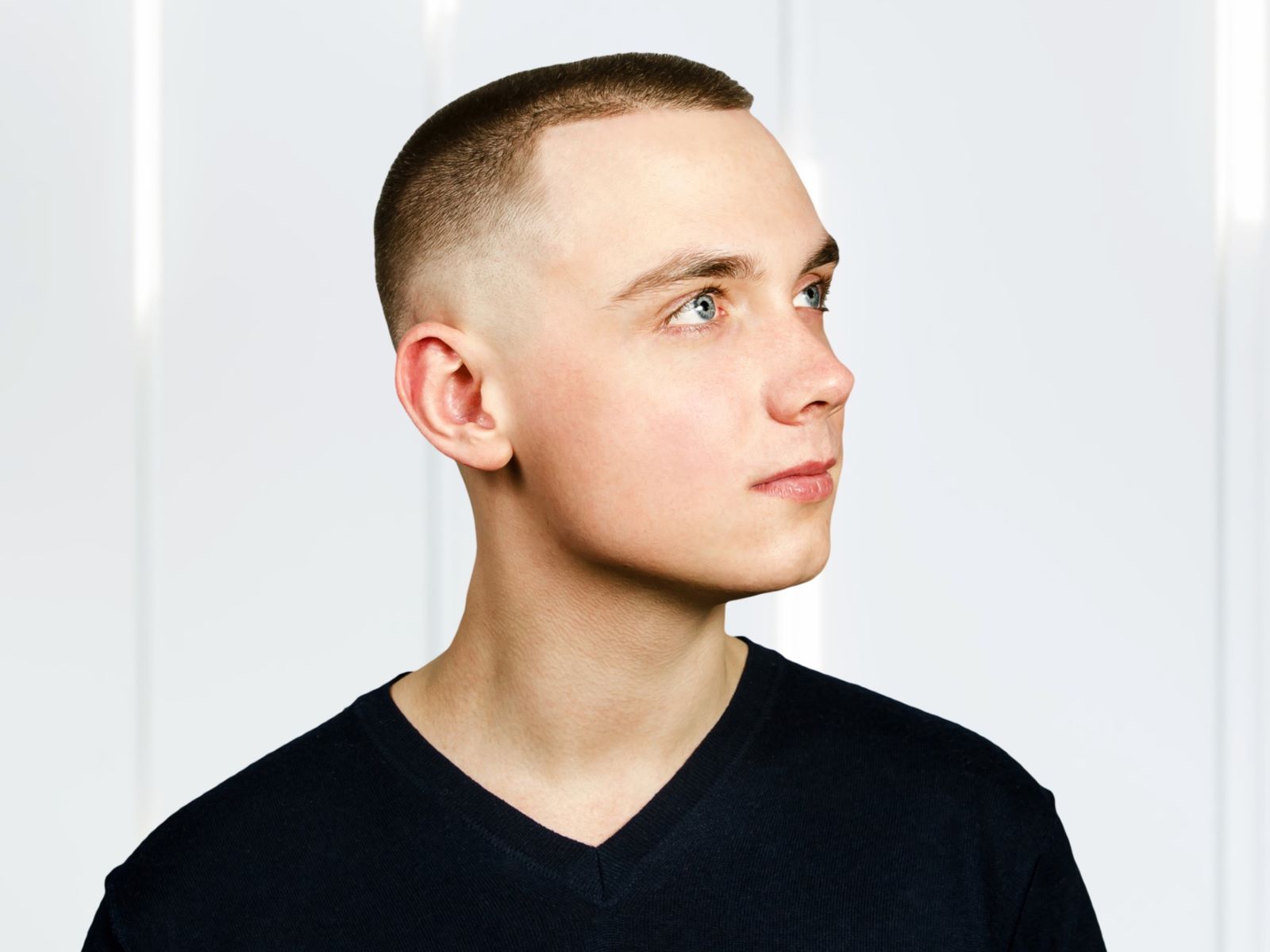 Young man with high and tight crew cut