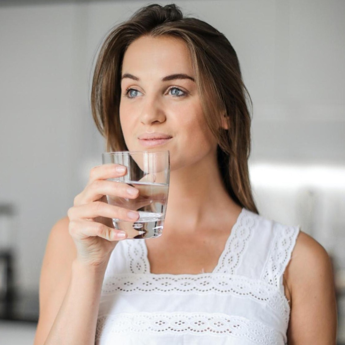 Drinking plenty of water to aid in hair health