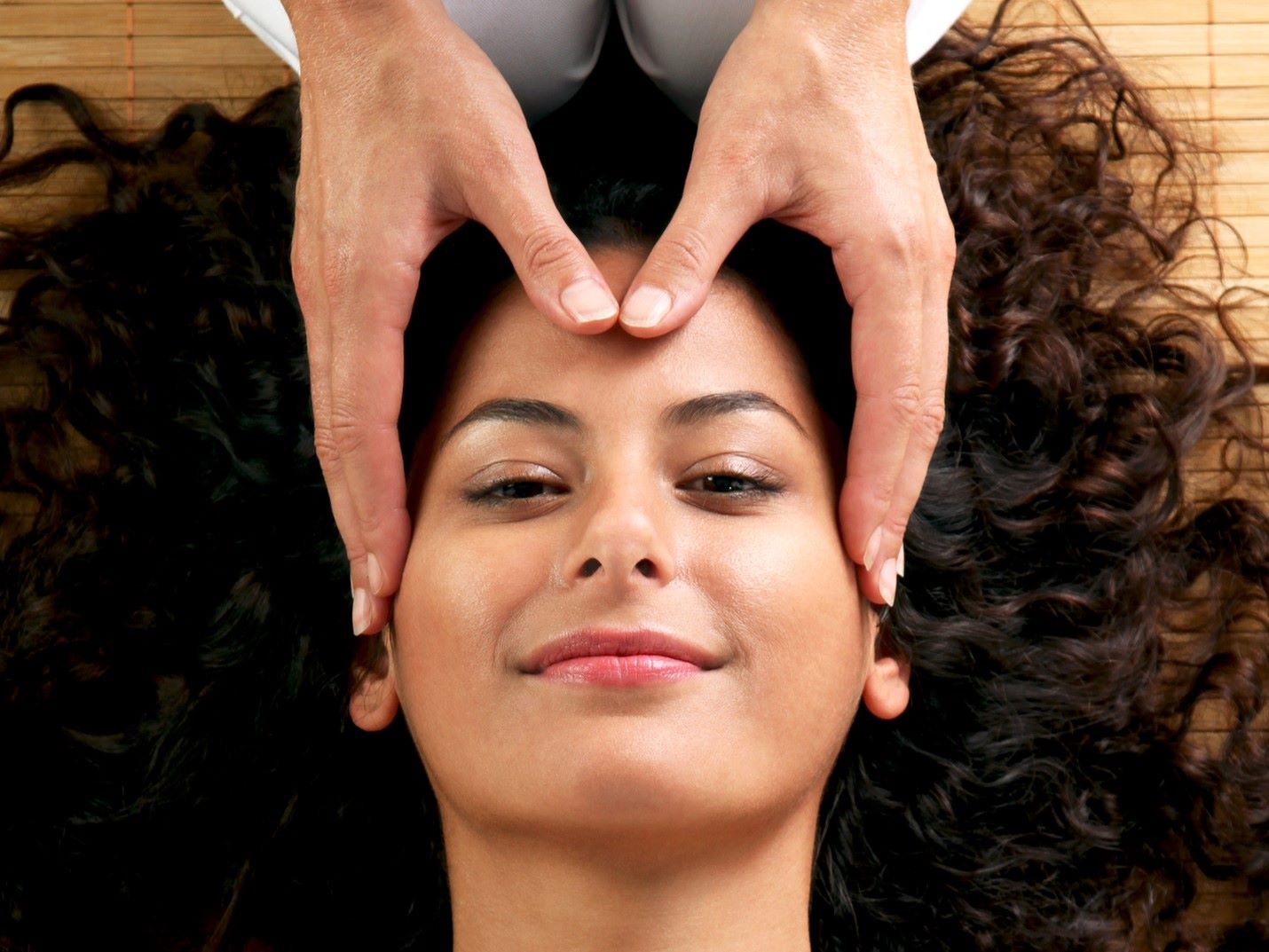 woman enjoying a traditional scalp massage