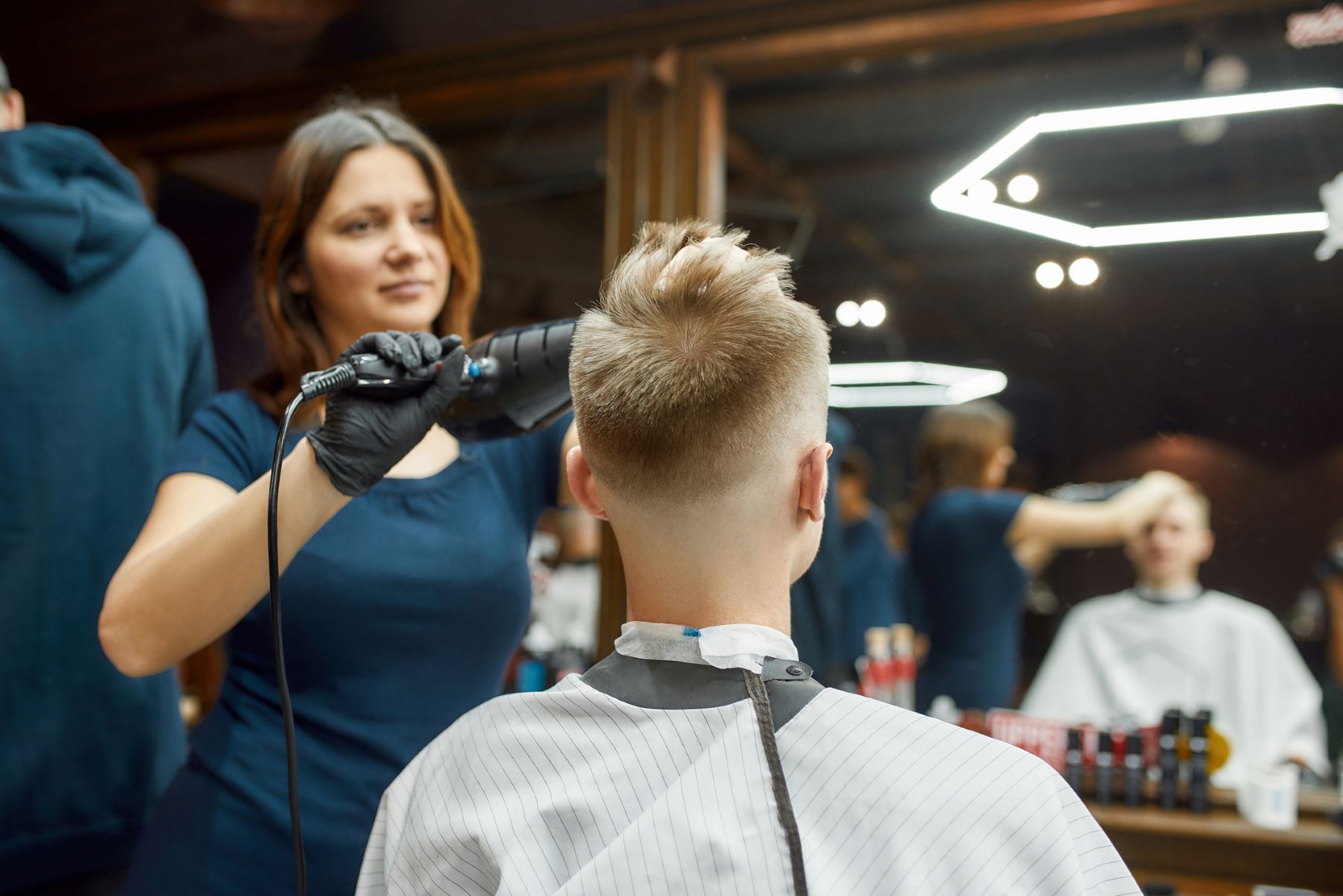 Hairdresser fixing a man’s widow’s peak
