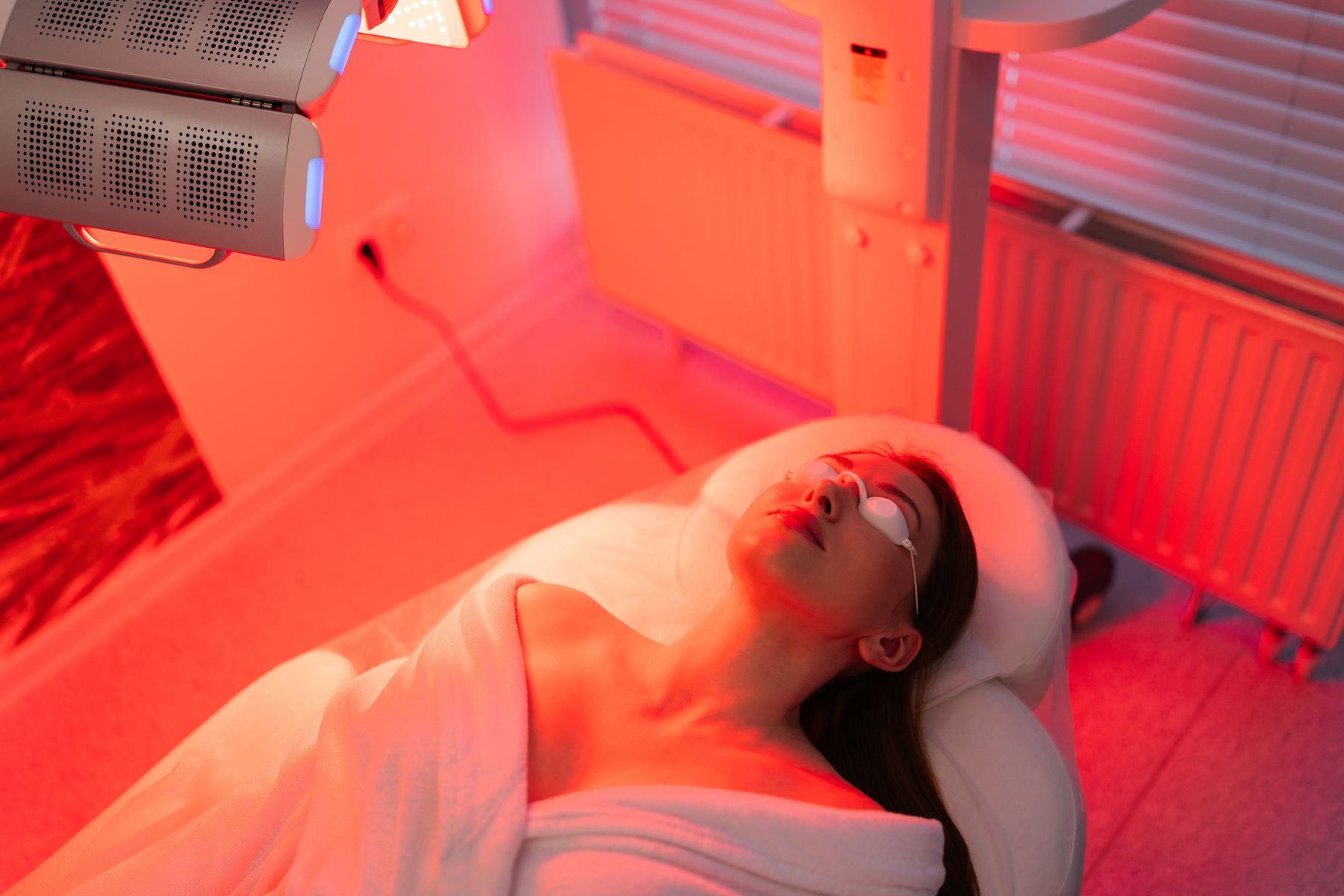 Woman benefitting from red light therapy for hair