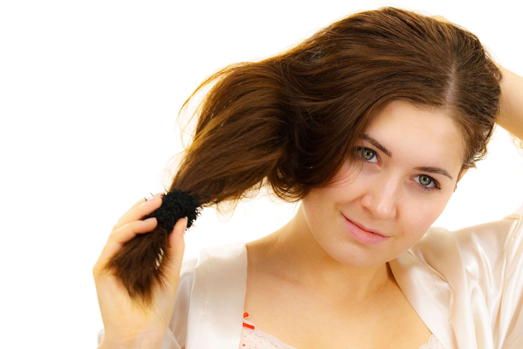 Woman preventing temple hair loss by untying her hair