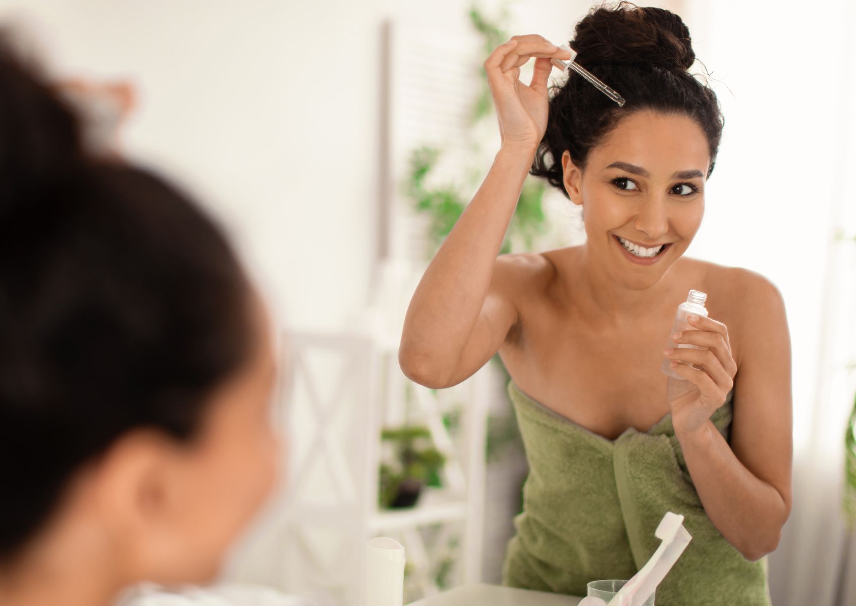 Woman treating her thinning fringe