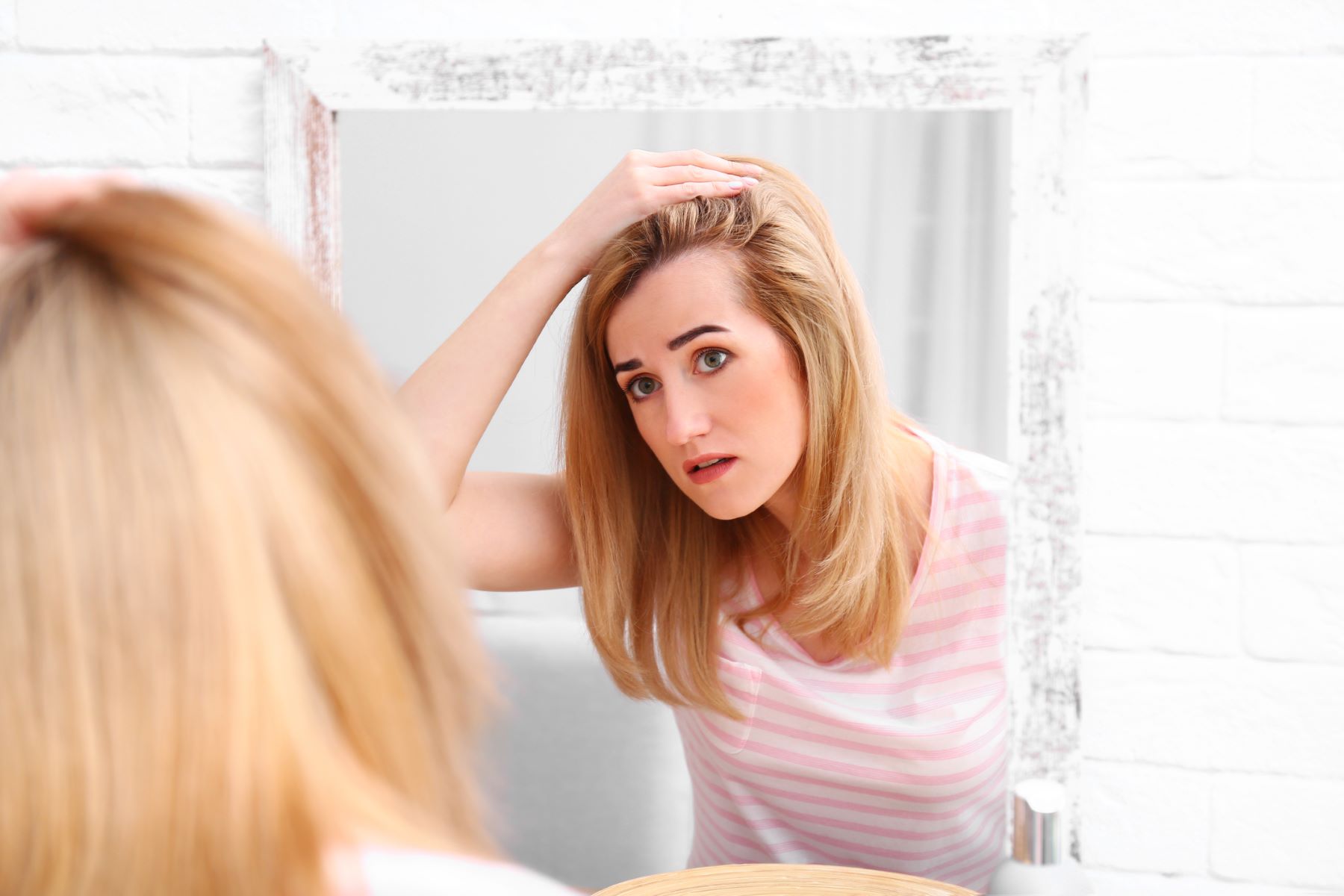 Woman wondering if scalp tenderness means hair loss