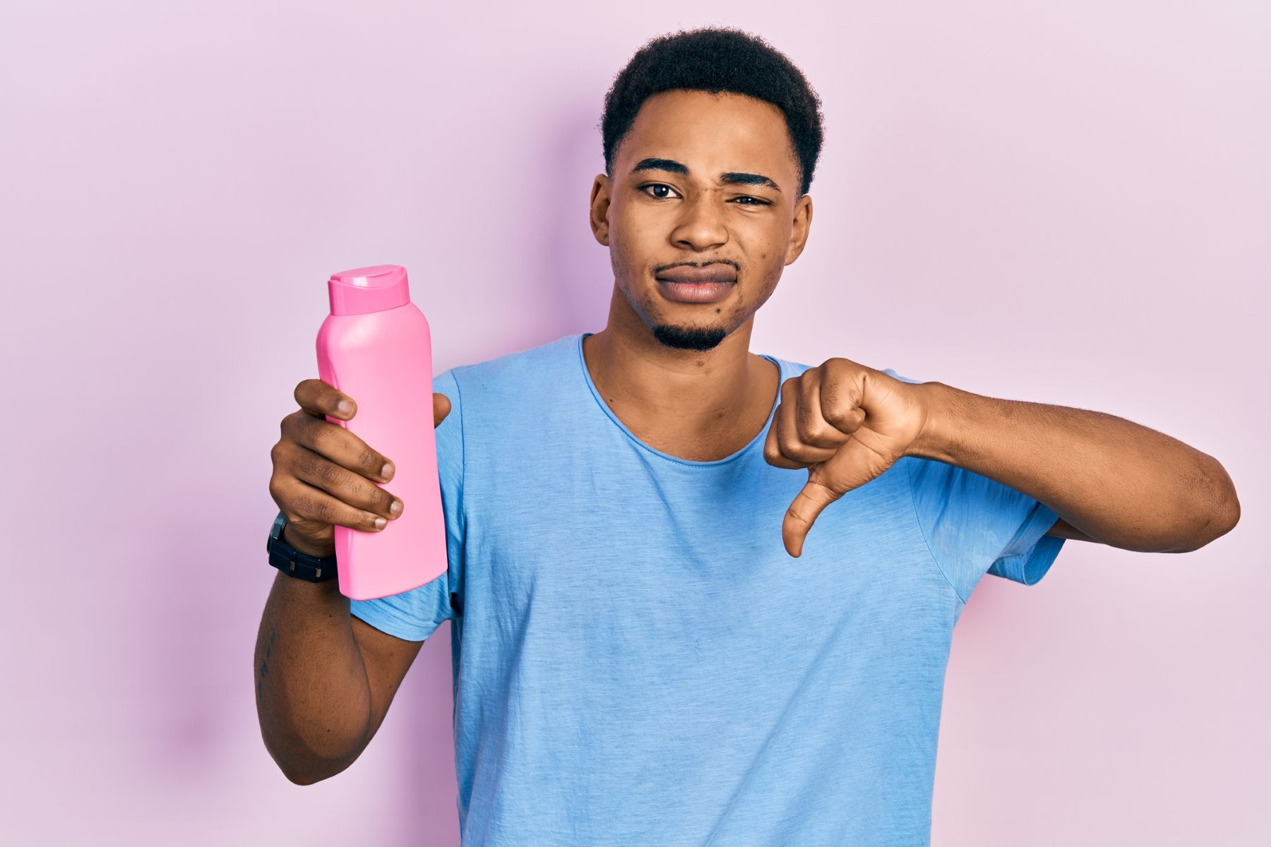 Man avoiding hair loss shampoo