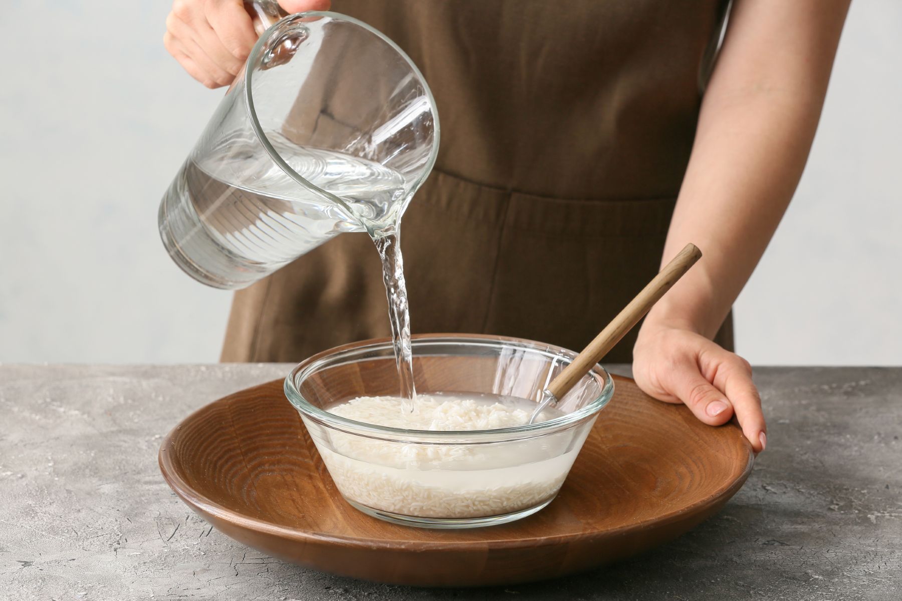 How do you prepare and use rice water for your hair?