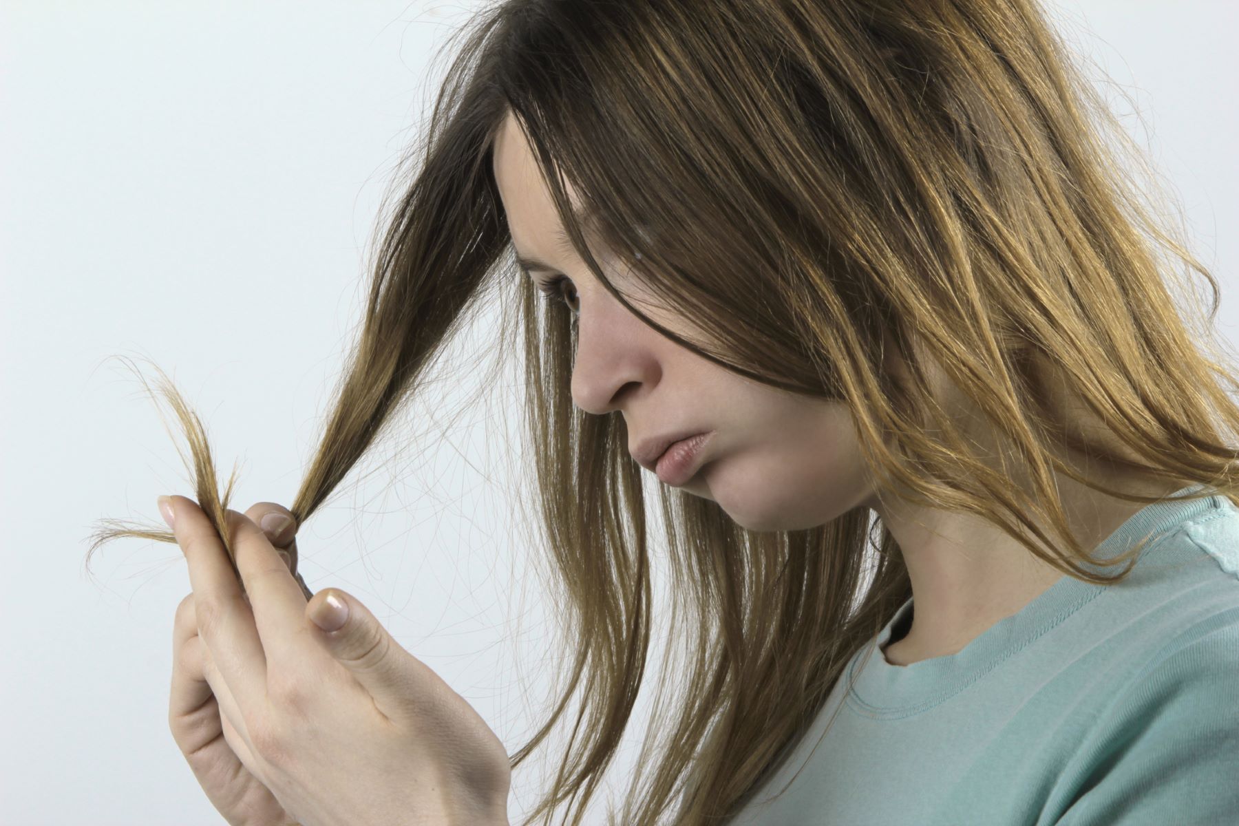 Woman with damaged hair from oxidative stress