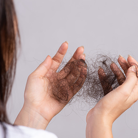 shedded hair in hands