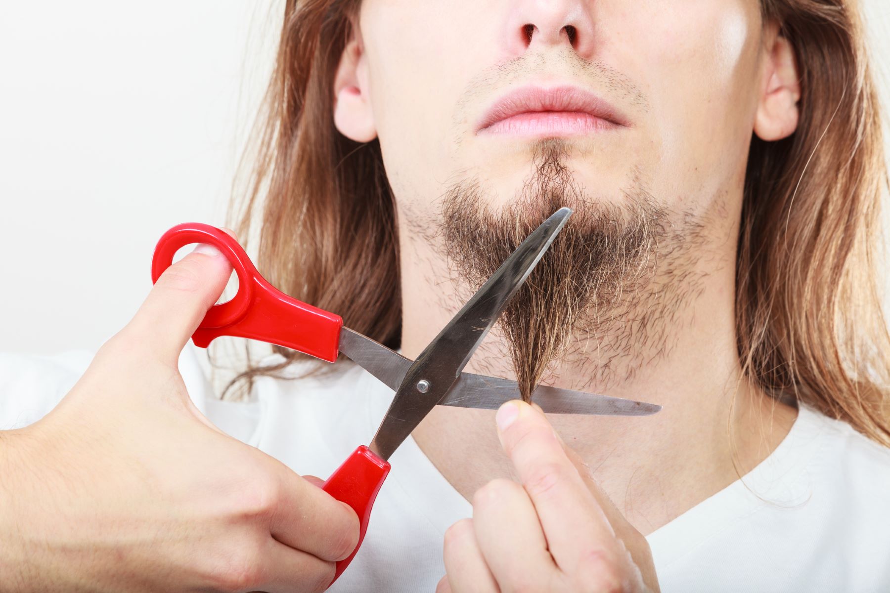 Man cutting his beard to the right length