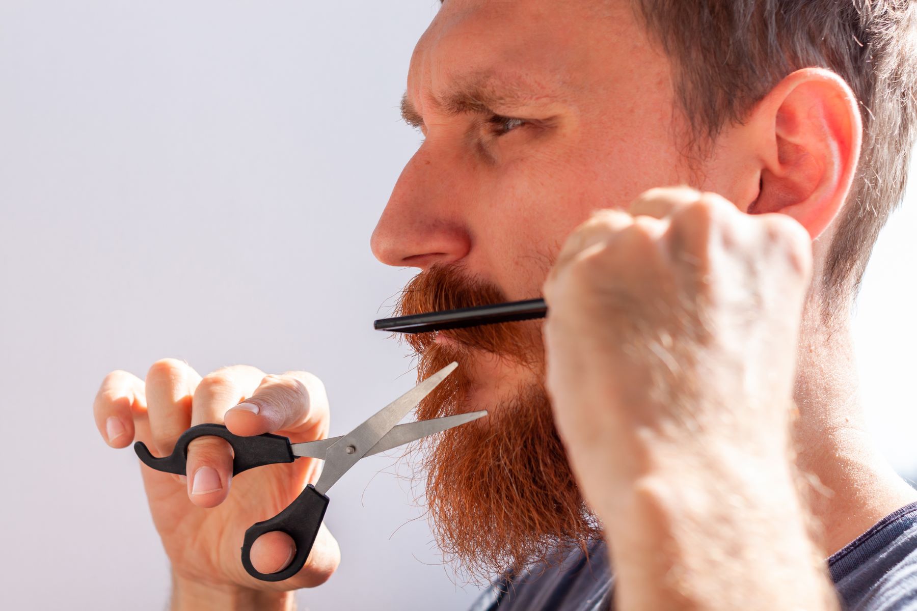 Man grooming his facial hair