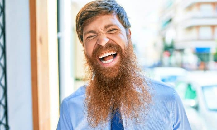 Man with a sparse, uneven long beard