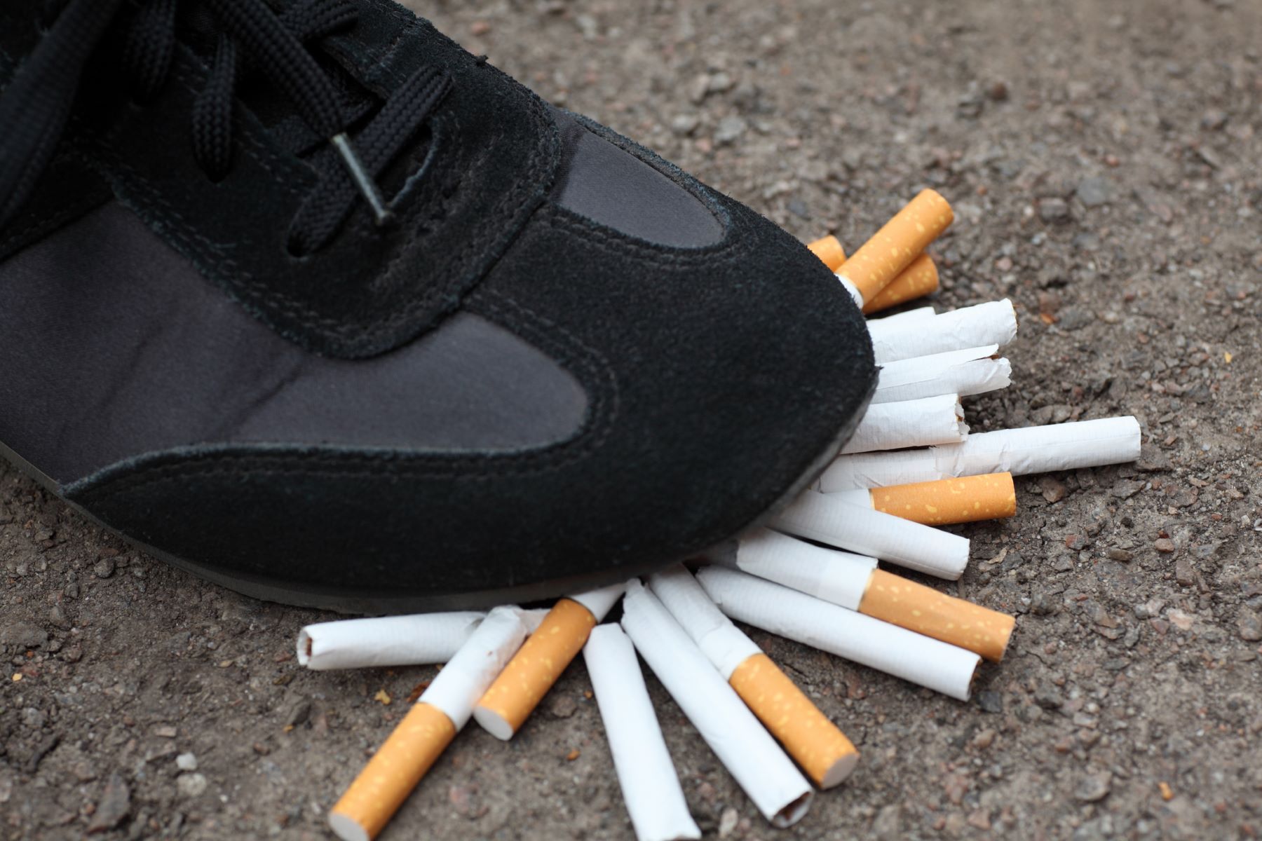 Stomping cigarettes to reduce or quit smoking