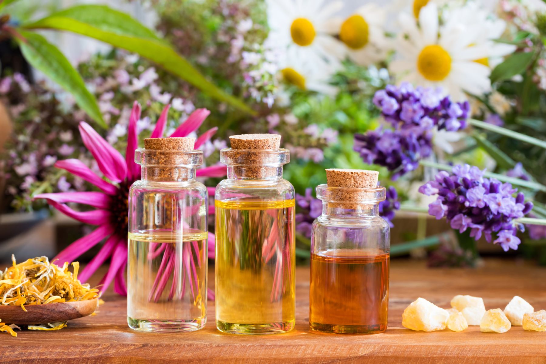 Three bottles of essential oils for hair