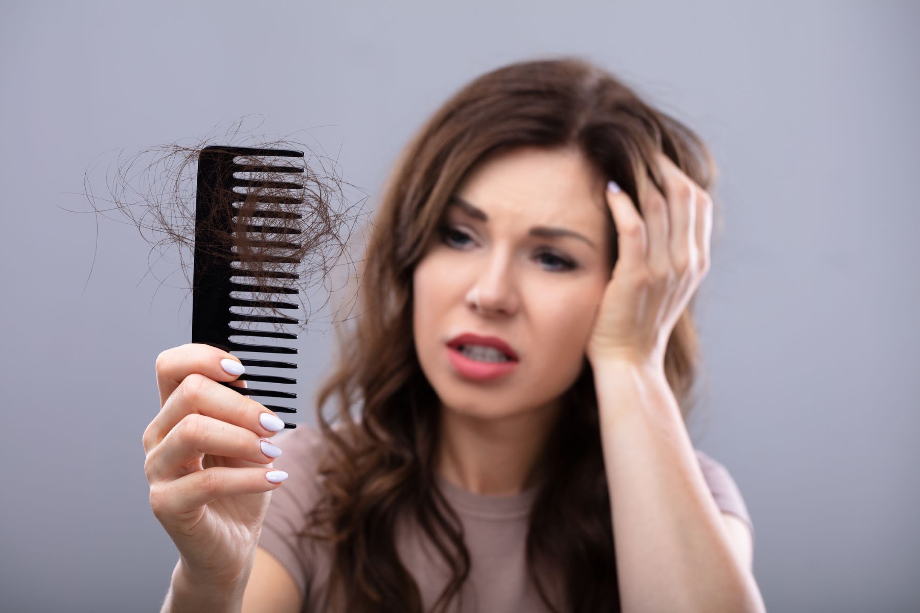 Woman hair loss after brushing hair