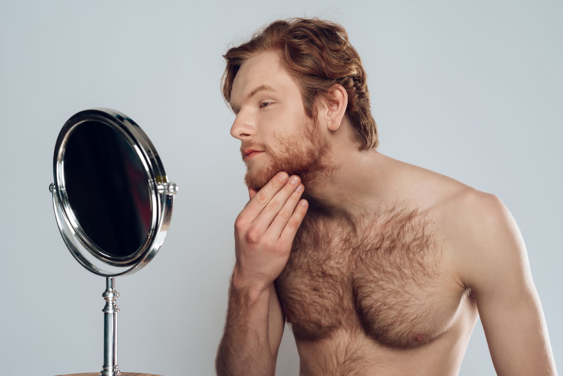 A young man struggling to grow a full beard