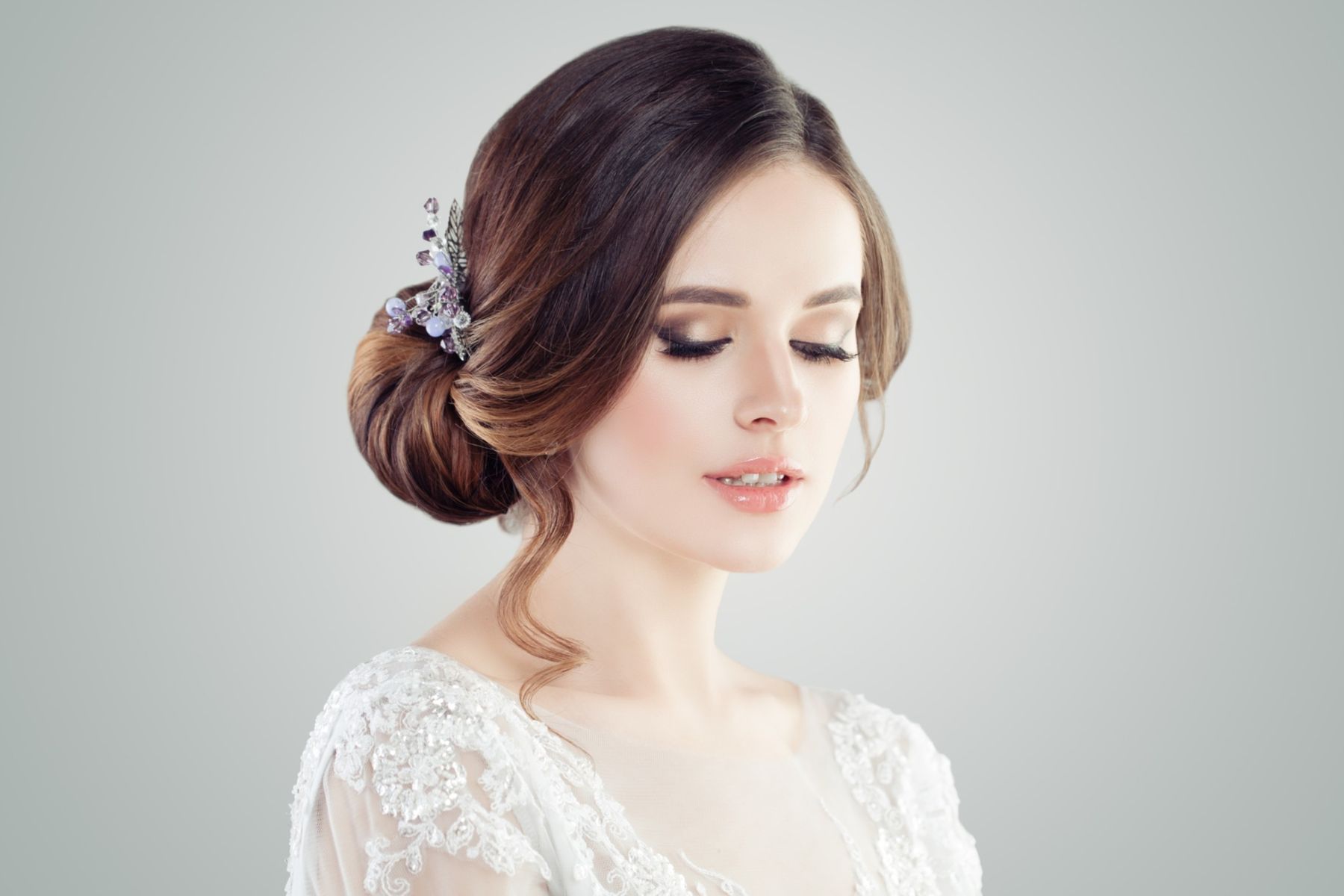 Bride with a formal sleek side bun and fringe