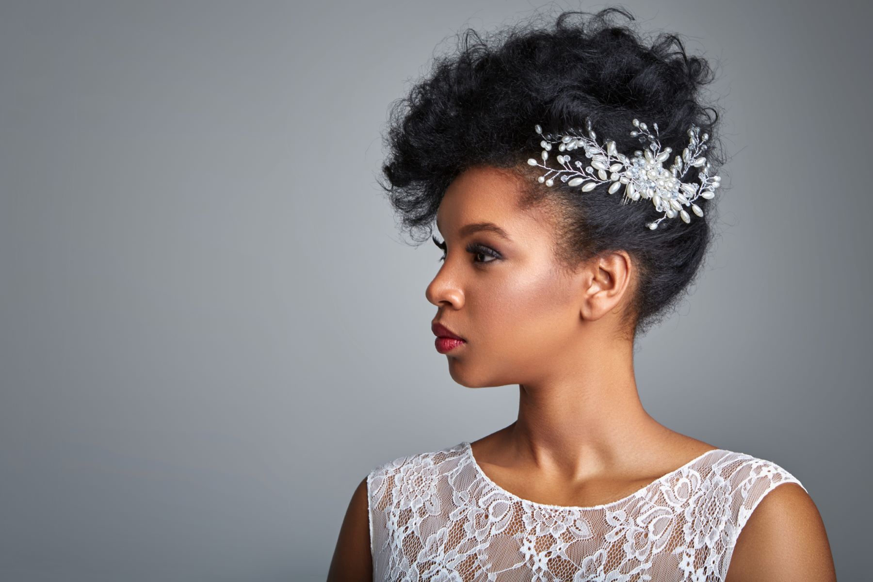Bride with an afro forward-combed updo