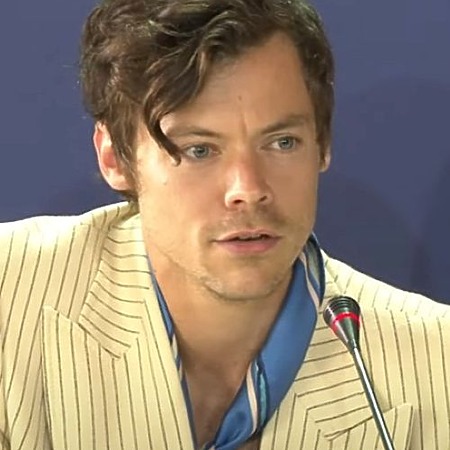 Harry Styles with a side-swept asymmetric fringe