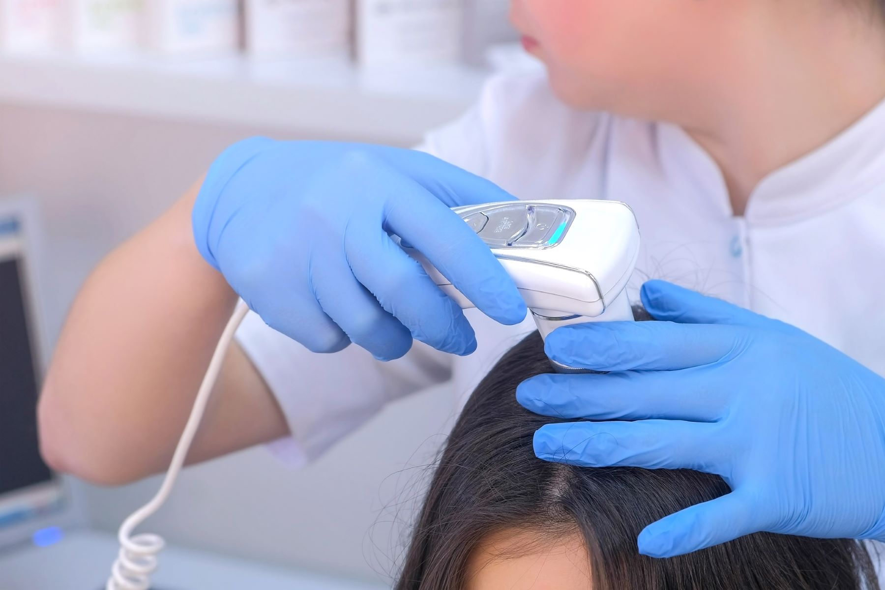 Trichologist performs diagnostic tests for hair loss