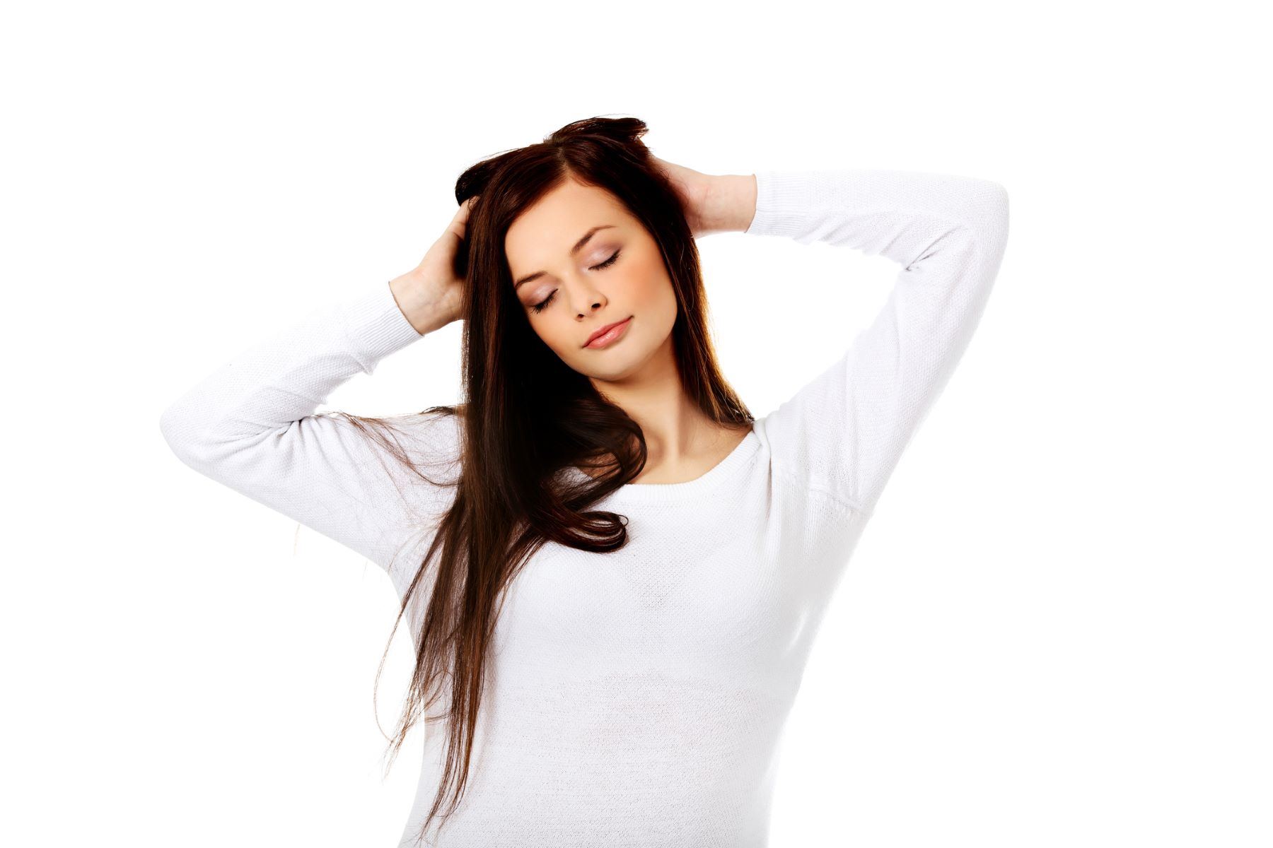 Woman massaging her head with gentle, circular motions