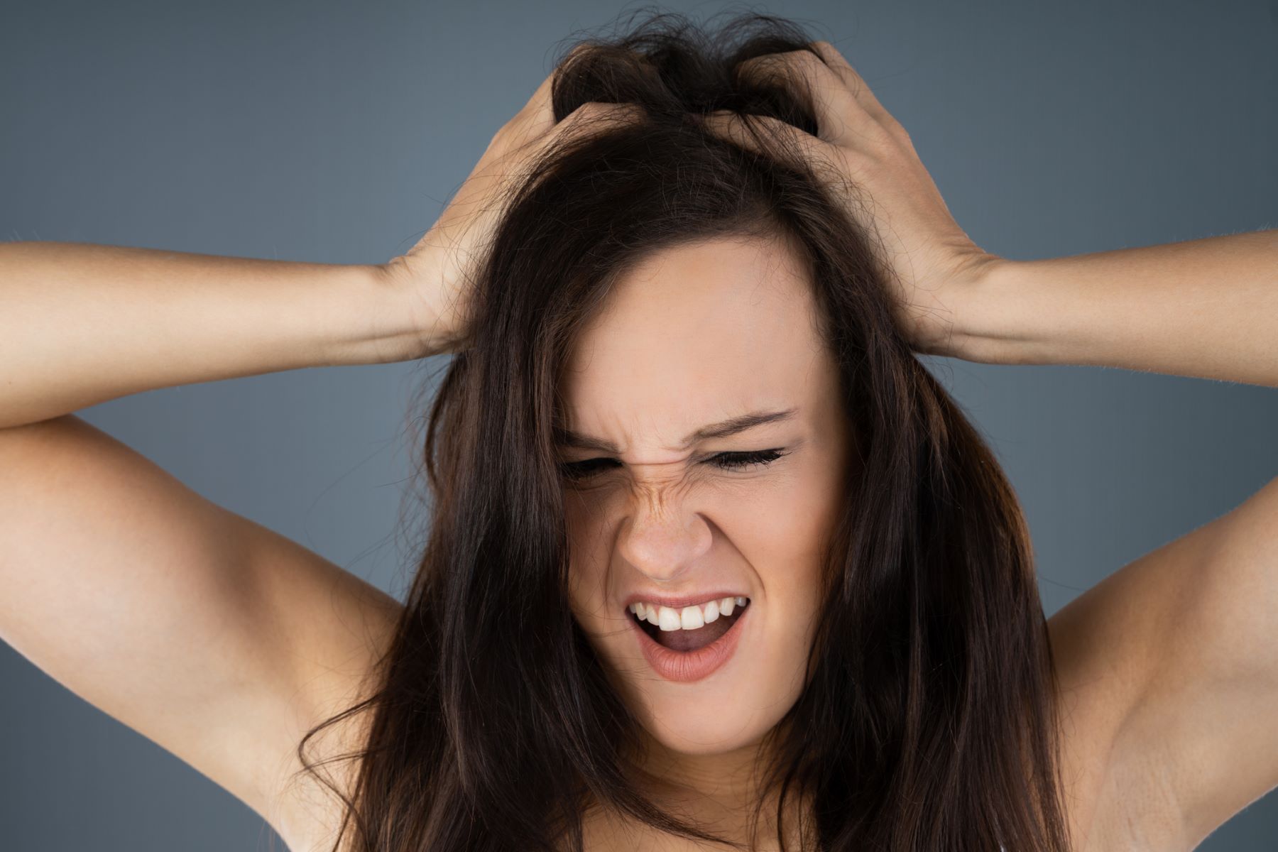 Woman with sore scalp after getting a head massage