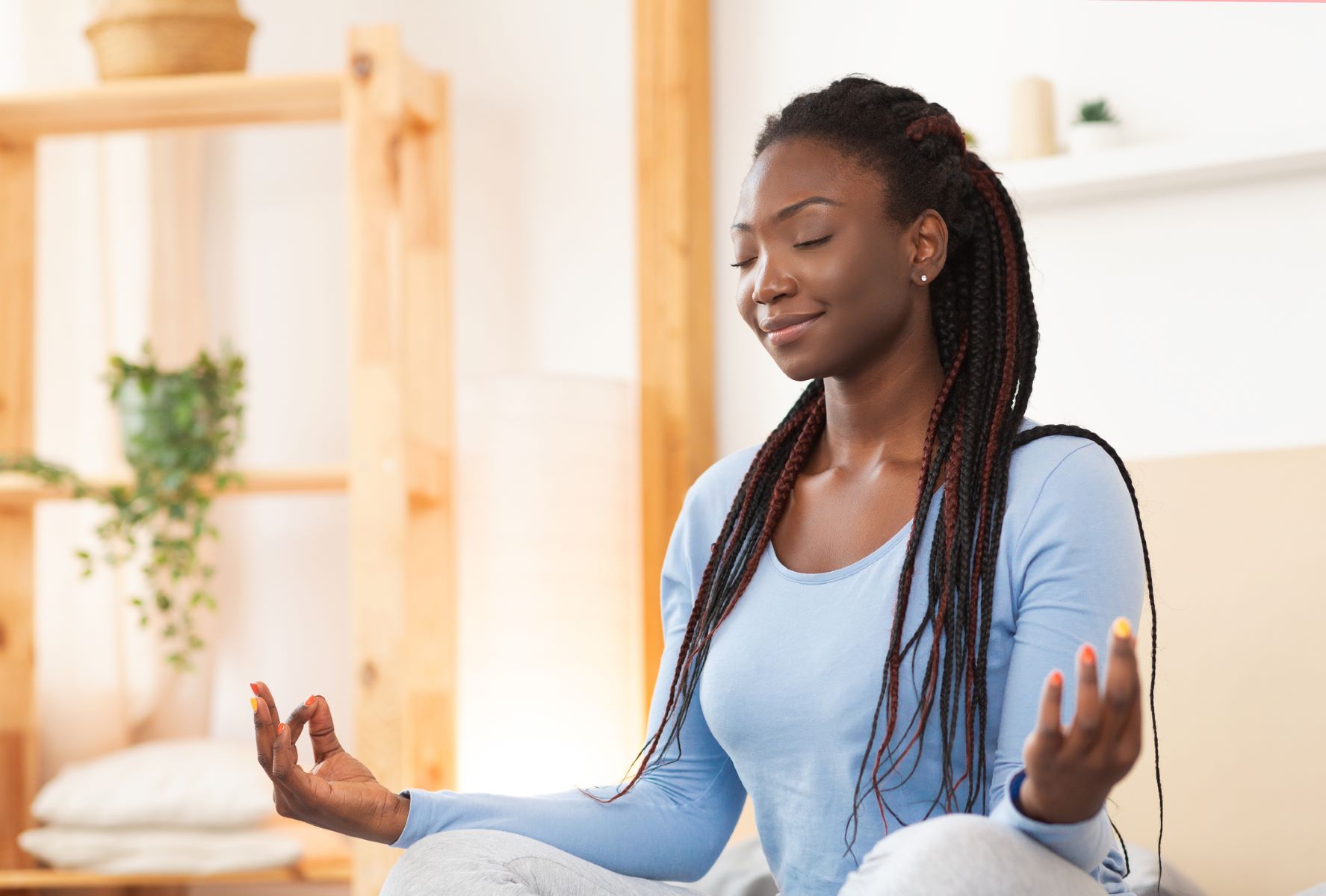 Woman meditating to reduce the stress in her life