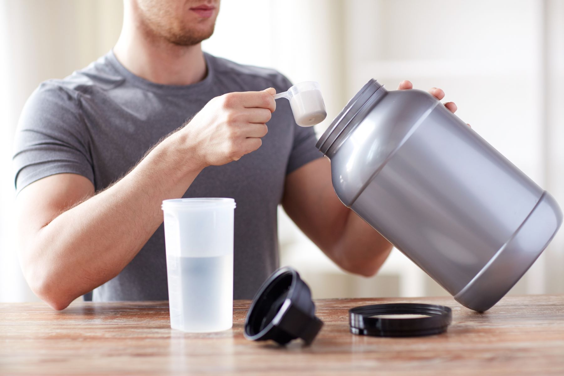 Man taking protein dietary supplements for hair growth