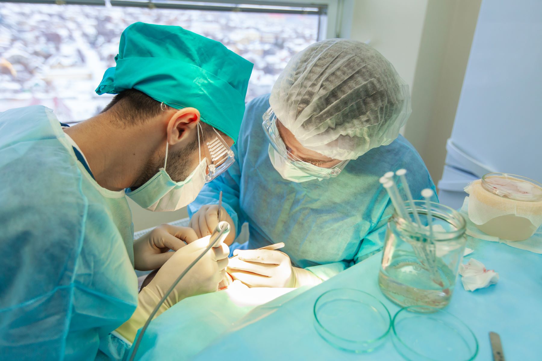 Surgeons performing a moustache transplant