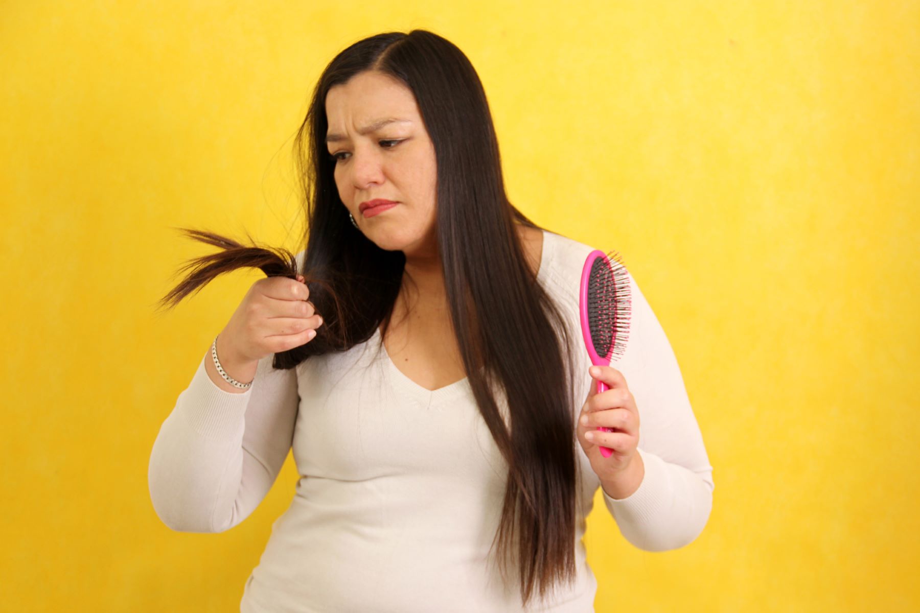 Woman with split ends and hair loss