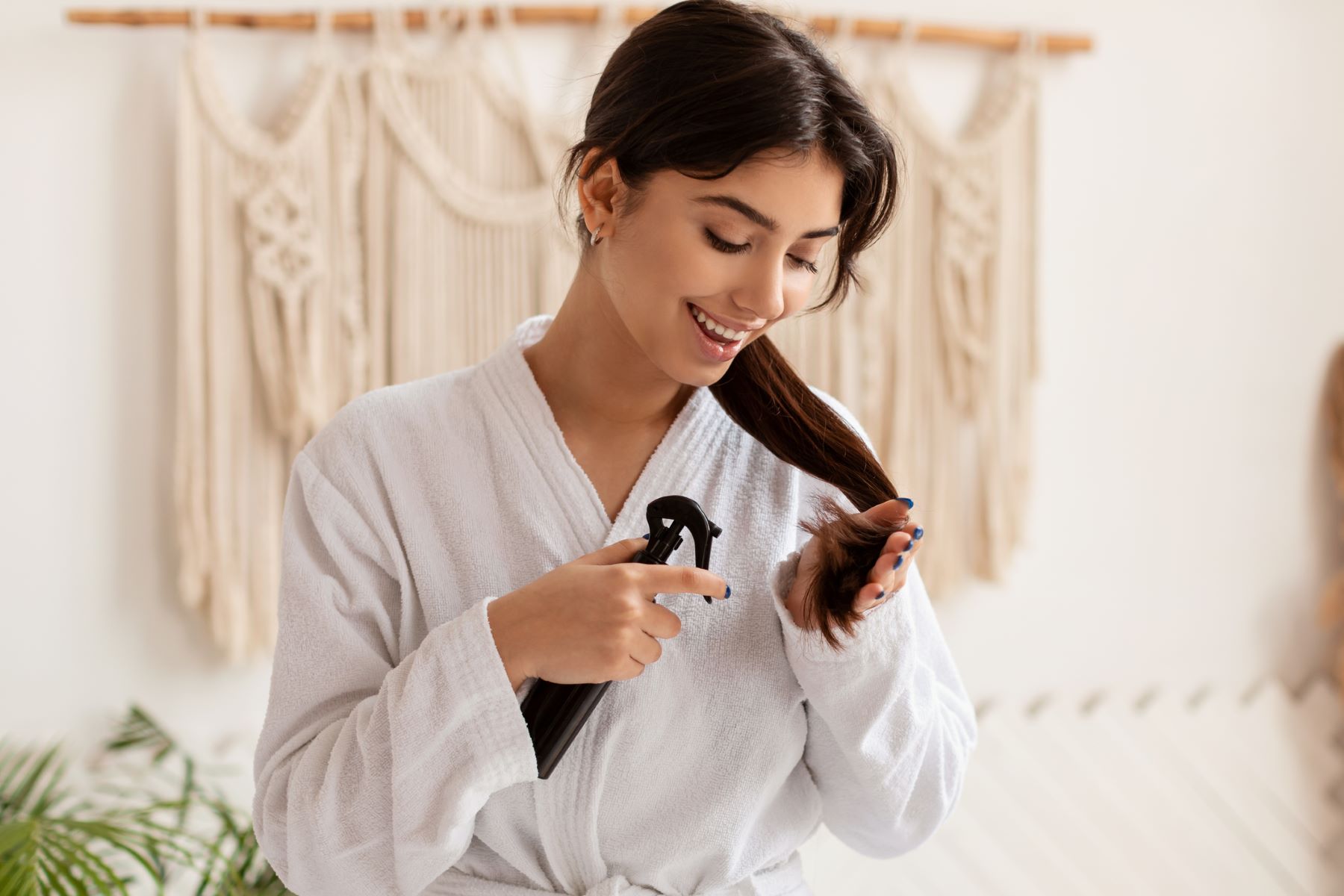 Woman using rosemary water on her hair