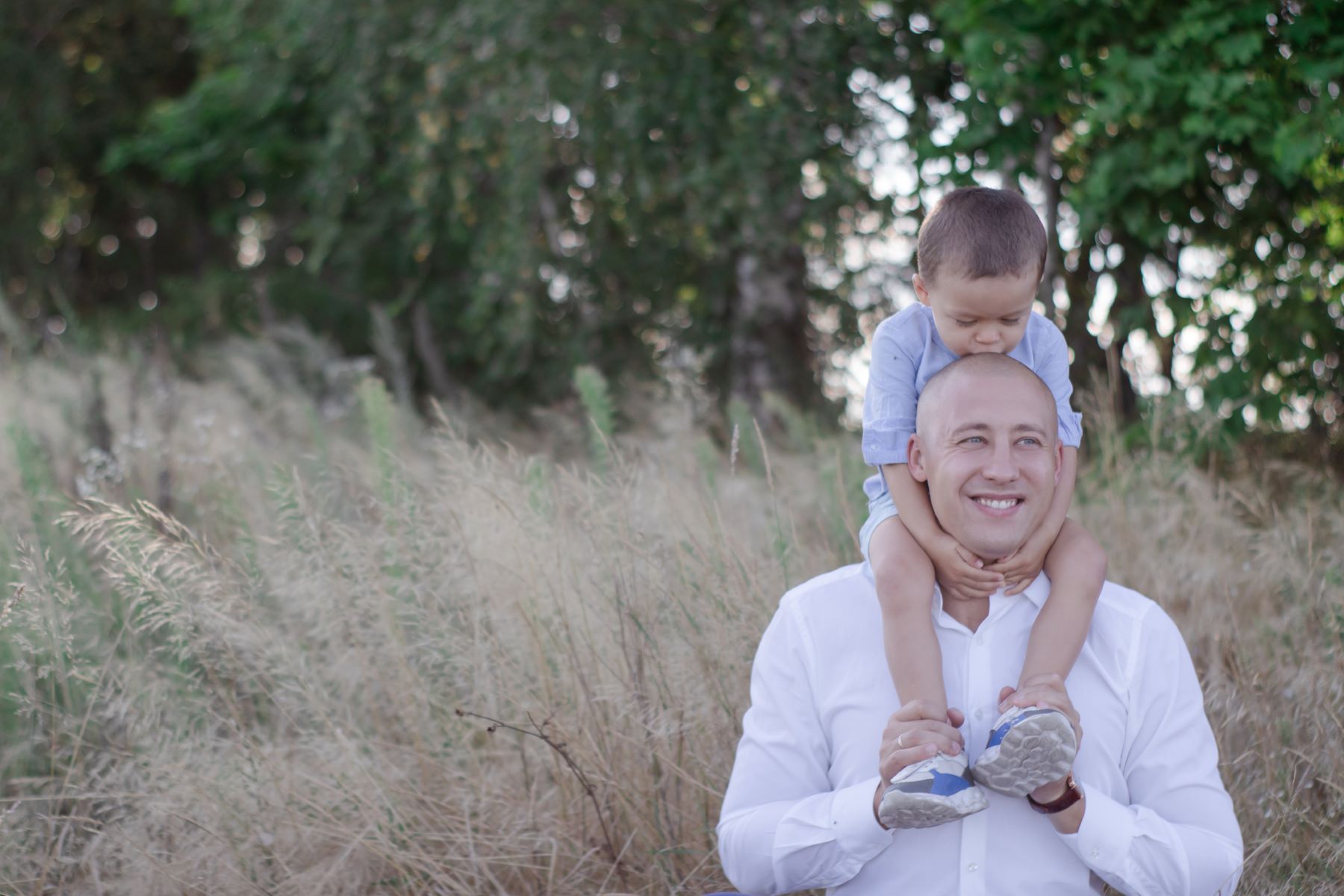 Balding father with young son