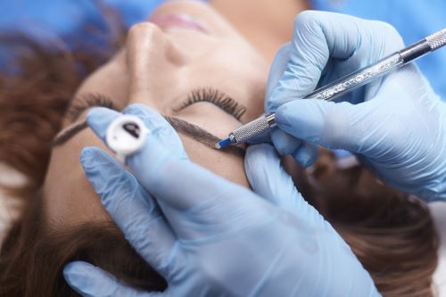 Eyebrow microblading procedure.