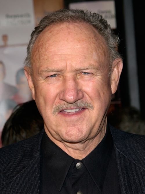 Gene Hackman pairs his older men’s hairstyle for thinning hair with a neat moustache