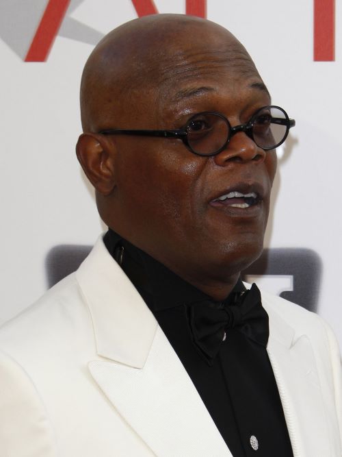 Shaving your head is the ultimate haircut for thinning hair in men, worn here by Samuel L Jackson