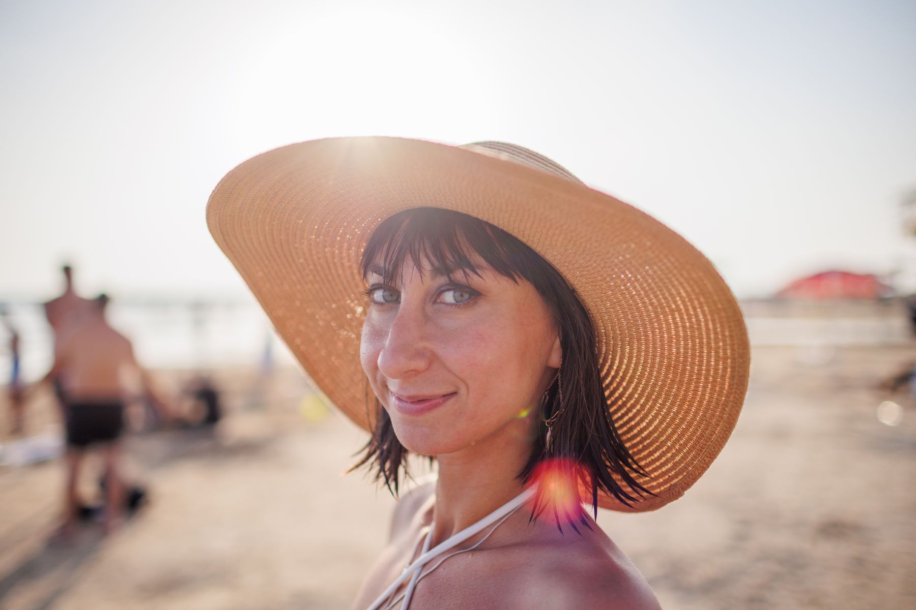 Woman covering her hair from the sun