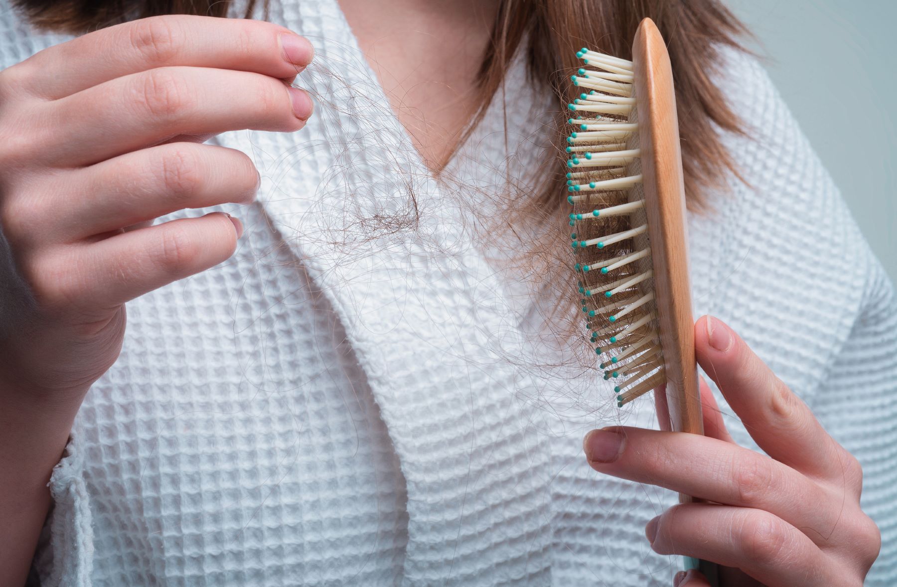 Woman experiencing hair loss