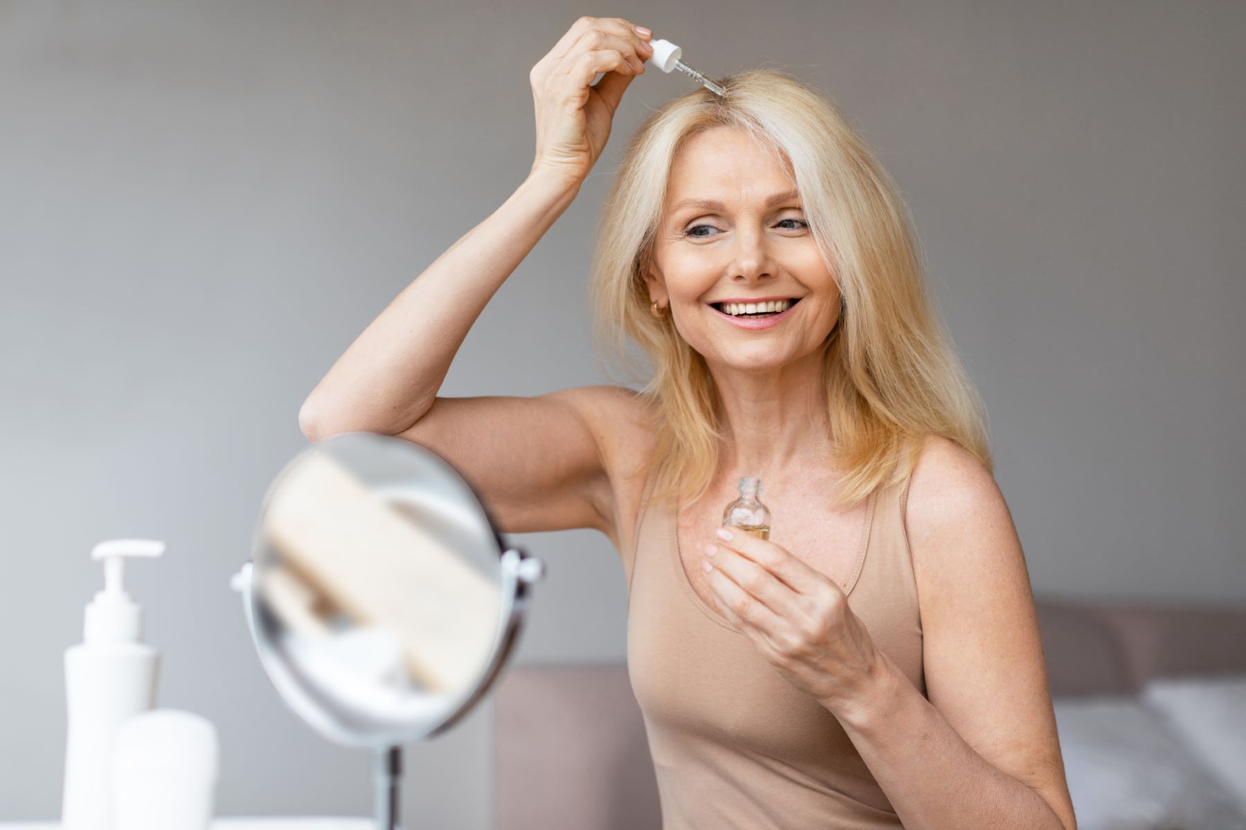 Woman using black seed oil on her hair