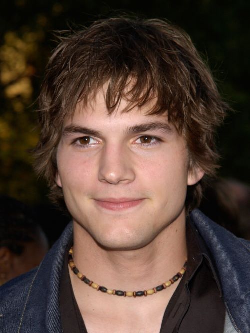 Ashton Kutcher wearing a surfer cut