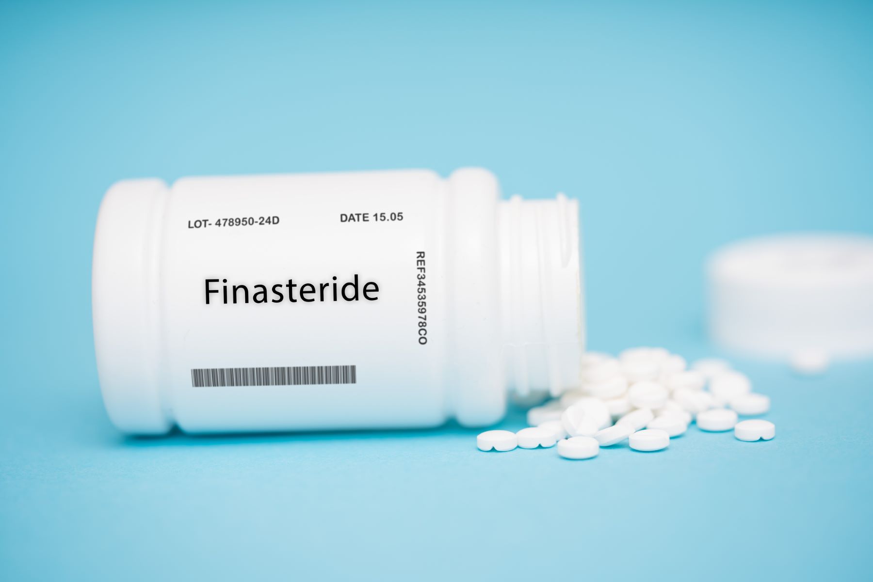 Finasteride pills and container