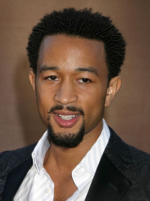 John Legend wearing a short afro cut