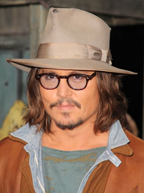 Johnny Depp wearing long hair with a hat